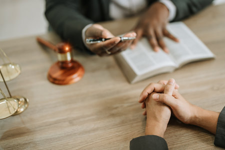 african american attorney, lawyers discussing contract or business agreement at law firm office, Business people making deal document legal, justice advice service concepts.の写真素材