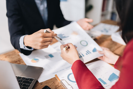 startup business, business advisor leadership for planning finance investment teamwork paperwork audit and discussing marketing, profit, budget of company in meeting roomの写真素材