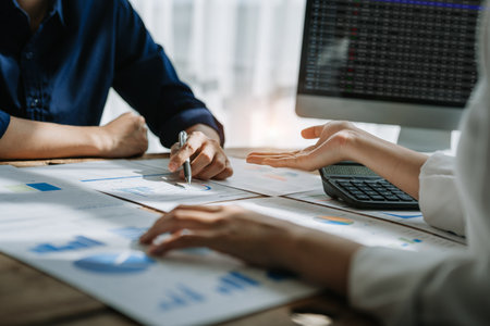 startup business, business advisor strategy for planning finance investment teamwork paperwork audit and discussing marketing, profit, budget of company in meeting room, stock market chart conceptsの写真素材