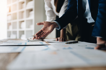 Asian business advisor meeting to analyze and discuss the situation on the financial report in the meeting room.Investment Consultant, Financial , teamwork ,brainstorming ,startup and accounting.の写真素材