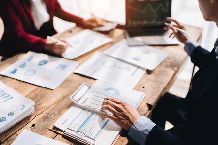 startup business, business advisor strategy for planning finance investment teamwork paperwork audit and discussing marketing, profit, budget of company in meeting room, stock market chart conceptsの写真素材
