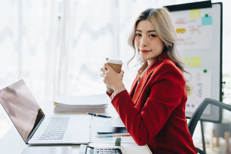 Business, finance and employment, female successful entrepreneurs concept. Confident smiling asian businesswoman, using laptop at workの写真素材