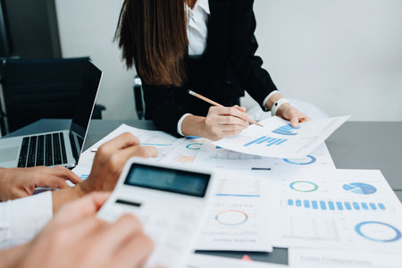 startup Asian business advisor meeting to analyze and discuss the situation on the financial report in the meeting room.Investment Consultant, Financial , teamwork ,brainstorming and accountingの写真素材