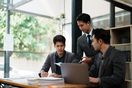 startup Asian business advisor meeting to analyze and discuss the situation on the financial report in the meeting room.Investment Consultant, Financialの写真素材