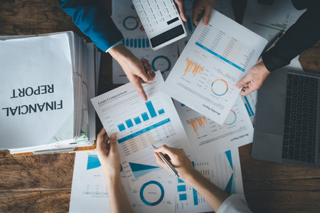 Asian business advisor meeting to analyze and discuss the situation on the financial report in the meeting room.Investment Consultant, Financial , teamwork ,brainstorming ,startup and accounting.の写真素材