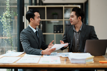 startup Asian business advisor meeting to analyze and discuss the situation on the financial report in the meeting room.Investment Consultant, Financialの写真素材