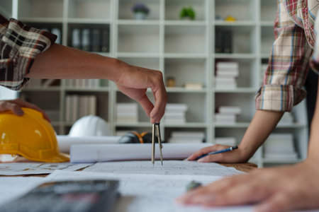 Engineers, designers and interior designers are finalizing the design of interiors by discussing selecting materials and colors to design rooms to present to clientsの写真素材