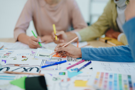 Group of asian creative team programing designers participate in all phases of the UX UI designの写真素材