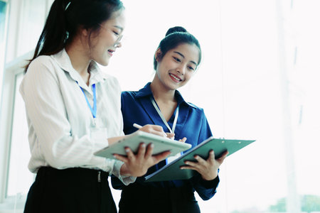 startup business, business advisor leadership for planning finance investment teamwork paperwork audit and discussing marketing, profit, budget of company in meeting roomの写真素材