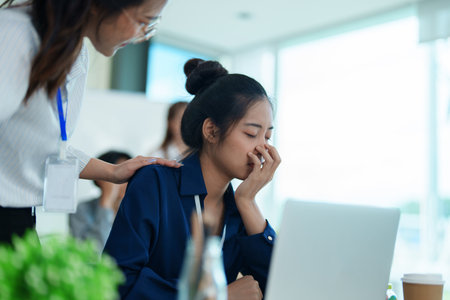 Burnout, stress and business man overworked from too much, work overload and pressure marketing corporate company. Time management, frustrated and tired employeeの写真素材