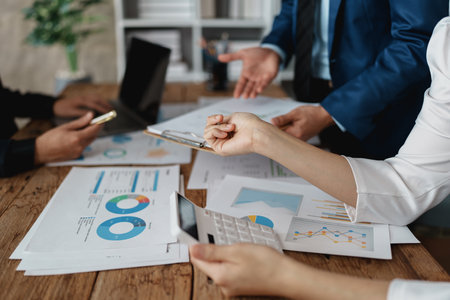 startup Asian business advisor meeting to analyze and discuss the situation on the financial report in the meeting room.Investment Consultant, Financial , teamwork ,brainstorming and accounting.の写真素材