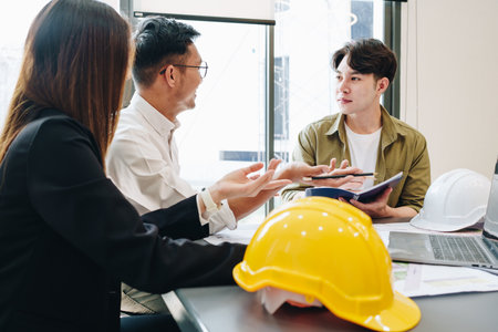 Engineers, designers and interior designers are finalizing the design of interiors by discussing...