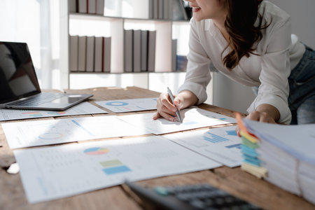 planning, auditing, business planning, finance, young asian business woman working on computer and checking investment documents and planning marketing to increase profit, business conceptsの写真素材