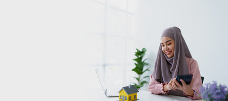 muslim woman with hijab using calculator focus on utility bills calculate check credit card receipt...