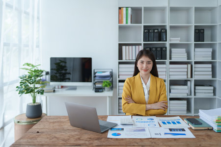 Portrait of a woman business owner showing a happy smiling face as he has successfully invested her businessの写真素材