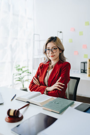 Portrait of a Asian woman lawyer studying a lawsuit for a client before going to court.の写真素材