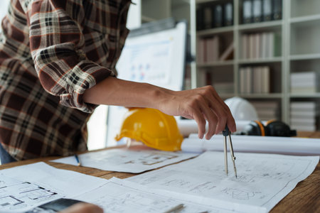 Engineers, designers and interior designers are finalizing the design of interiors by discussing selecting materials and colors to design rooms to present to clientsの写真素材