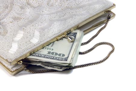 Money in a fancy, white, beaded purse.の写真素材