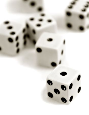 Six dice tossed onto a white background