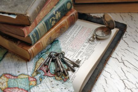 Antique Bible with keys and a map.の写真素材