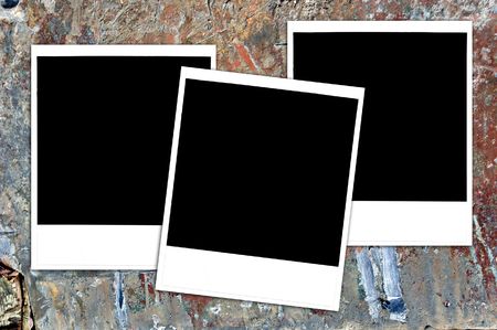 Instant photos on a grungy painted wood surface, blank for your image or text.の写真素材