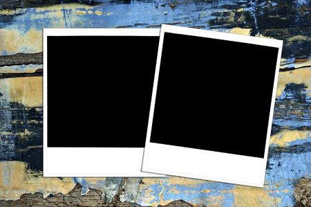 Instant photos on grungy painted wood, blank for your image or text.の写真素材