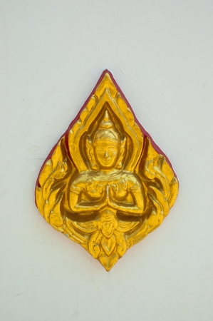 traditional Buddha statue on white wall backgroundの写真素材