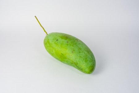 green mango isolated on white backgroundsの写真素材