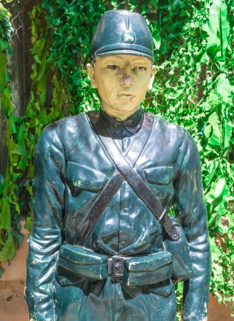 human army statue asia style on green grass backgroundsの写真素材