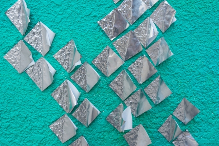 square paper silver on green concrete wall patternの写真素材
