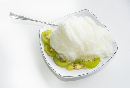 yogurt ice-cream and grenn fruit isolated on white backgroundsの写真素材