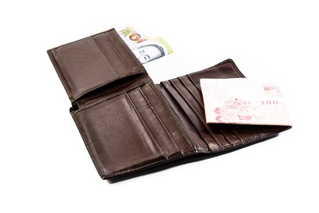 inside brown wallet and thailand money isolated on white backhrounds