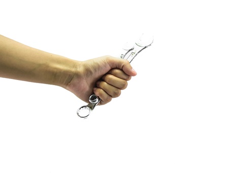 young girl hand hold two wrench steel isolated on white backgroundの写真素材