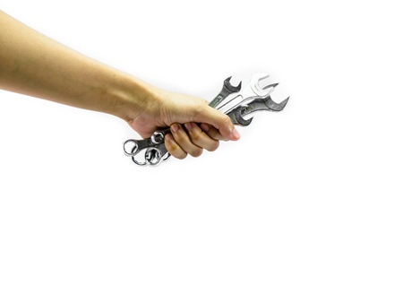 girl hand hold many wrench steel isolated on white backgroundの写真素材