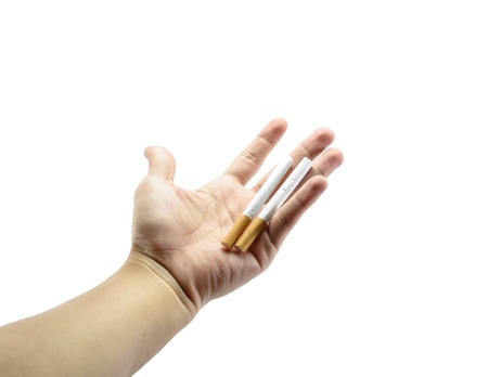 young man hand hold two cigarette isolated on white backgroundの写真素材