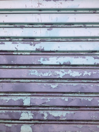 Old grunge steel green garage door pattern backgroundの素材