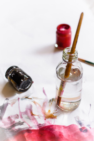 Paint brushes on paper painting set with watercolor bottleの写真素材