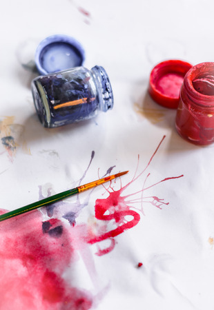 Paint brushes on paper painting set with watercolor bottleの写真素材