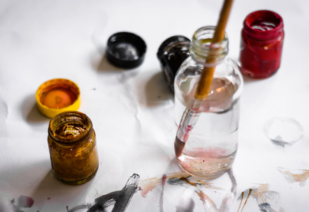 Paint brushes on paper painting set with watercolor bottleの写真素材