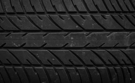 old pile of a worn out car tires pattern backgroundの写真素材