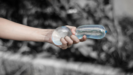 girl hand holding water balloon with retro filter at outdoor natural background