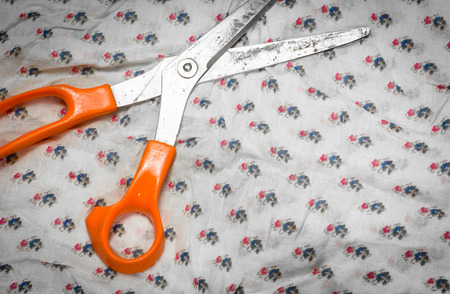 old scissors with textile fabric pattern の写真素材