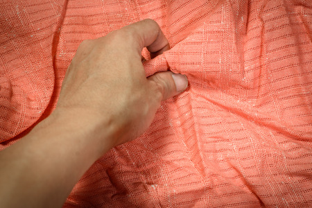 man hand touching cotton and fabric textile の写真素材