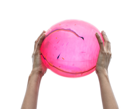 girl Hand holding color balloon isolated on white backgroundの写真素材