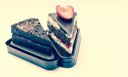 dessert strawberry cream and brownie  cake with retro filter on white background