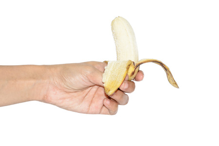 woman hand hold Ripe peeled banana isolated on white backgroundの写真素材