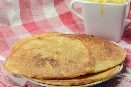dessert pancakes and butter cake on fabric plaid background.の写真素材
