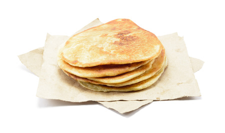 stack plain of pancakes at brown paper isolated on white background.