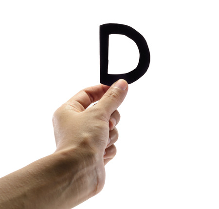 woman hand holding the black letter d, isolated on white backgroundの写真素材