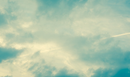 background of the evening clouds sky and light line with retro filter